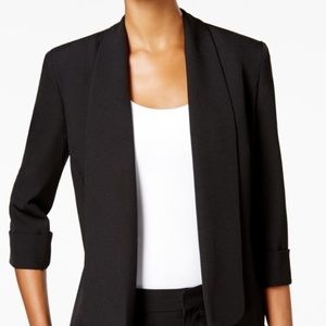 Black pants suit with three quarter length jacket